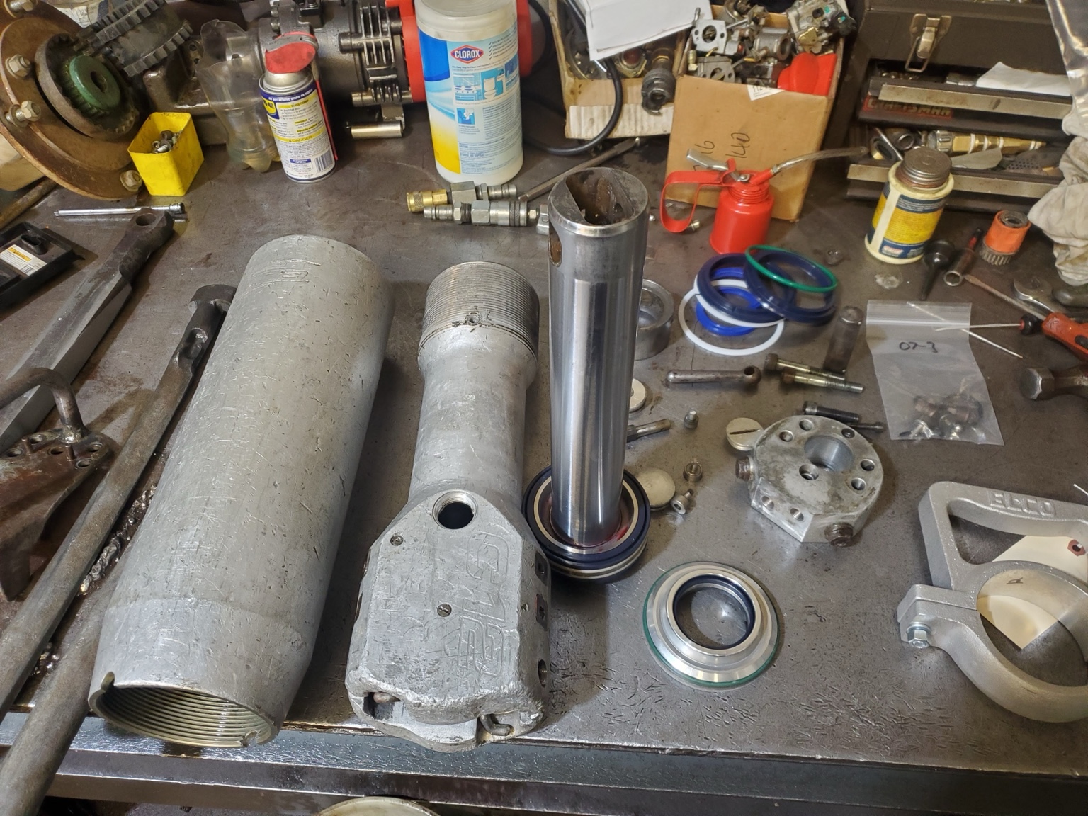 Hydraulic rock splitter disassembled for repair